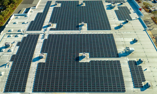 Industrial rooftop solar panels installed in Hyderabad under Telangana solar policy for efficient energy generation.